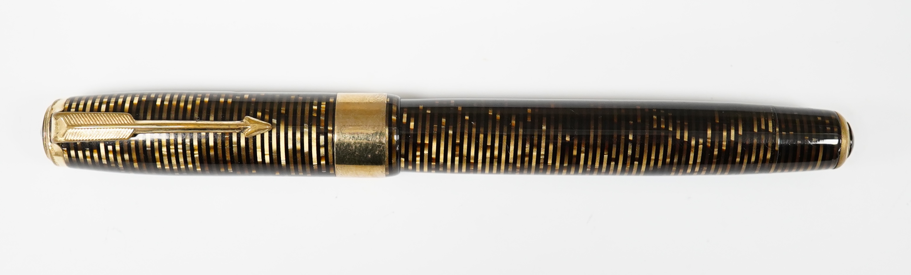 A Parker Vacumatic in brown with rare wide cap band